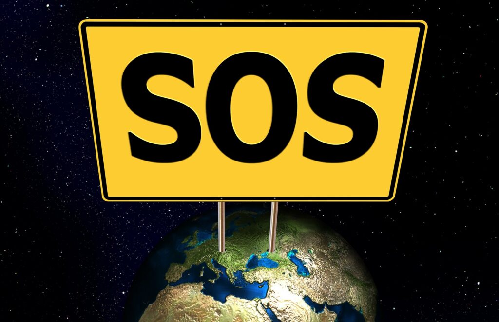 SOS sign on Earth looking from outer space