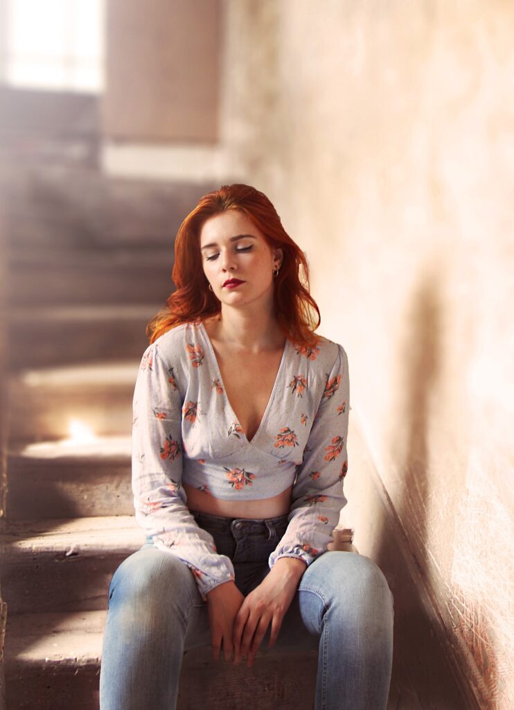 Sad girl sitting on a staircase